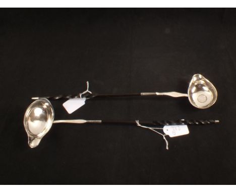 A white metal horn handled toddy ladle inset with 1787 6 pence plus one other with Lion Assay mark only