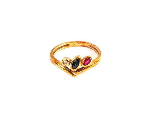 A yellow metal, ruby, sapphire and diamond ring