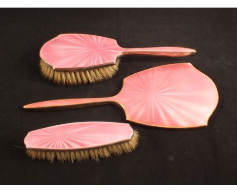 A silver and pink guilloche enamel brush and mirror set