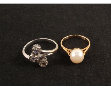 A 9ct gold ring set with single pearl and a 9ct gold purple and white stone set ring (one stone missing)