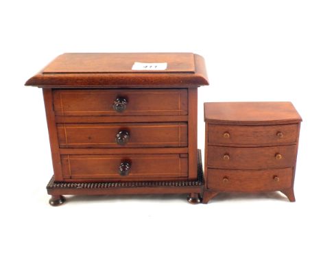 A miniature bow front chest of drawers plus a small chest of drawers