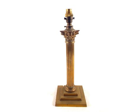 A brass Corinthian column oil lamp