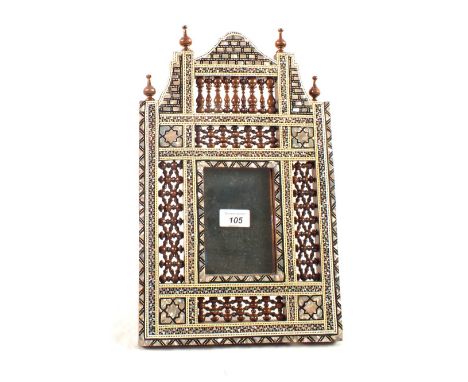 An Islamic mother of pearl inlaid easel mirror