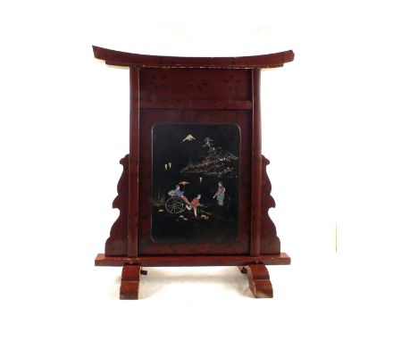 A Japanese maroon lacquer fire screen with black lacquer and Mother of Pearl geishas and rickshaw decoration