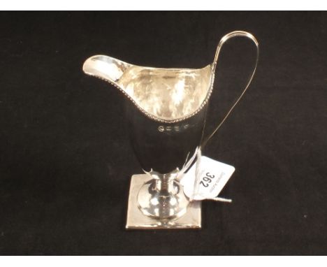 A 'helmet' silver cream jug, hallmark for London 1787, maker Sam Bradley (mark rubbed), sundry small bruises commensurate wit