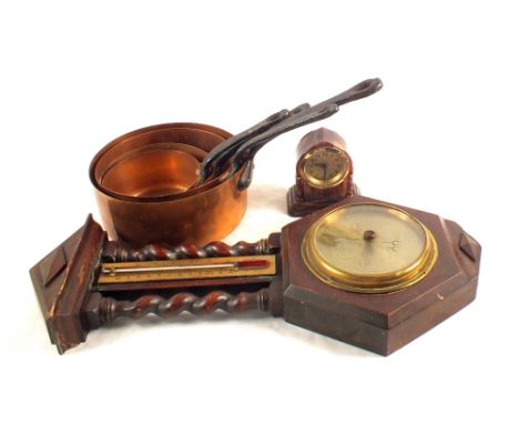 An oak and brass barometer, copper pans plus a small clock