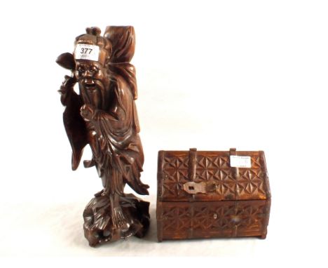 A Chinese carved hardwood Shou Lau table lamp plus an eastern carved wooden casket