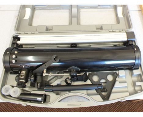 A cased reflector telescope on tripod