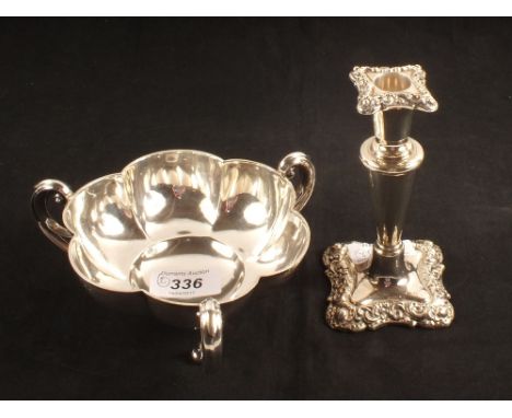 A silver three handled bowl and candlestick