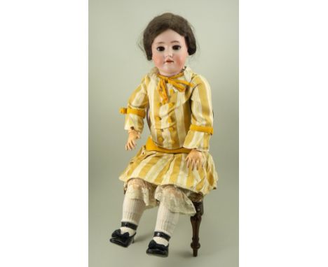 Large Heinrich Handwerck/S&amp;H bisque head doll, German circa 1910, with weighted brown glass eyes, real lashes, and raised