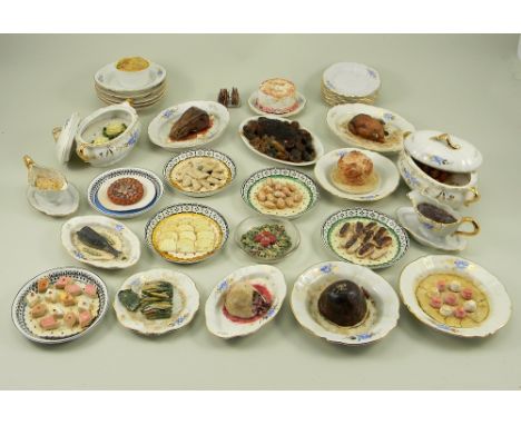 A collection of doll food, mostly on decorative ceramic dishes and including salmon with cucumber garnish, cream eclairs, Chr