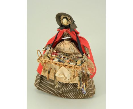 A good Grodnertal wooden pedlar doll, German circa 1820, with finely painted features, and painted black hair, on a peg-joint