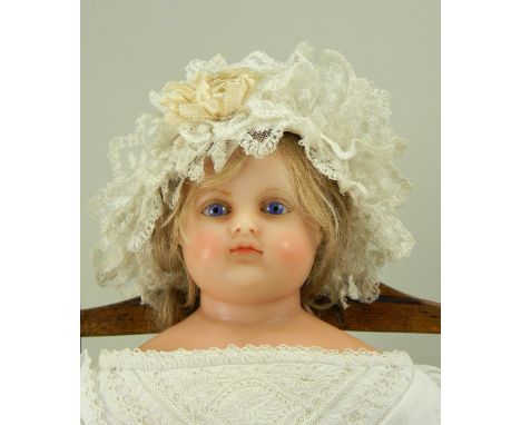 ‘Lilia’ a poured wax shoulder head doll by Montanari, English circa 1860, the beautifully moulded face with inserted blue gla