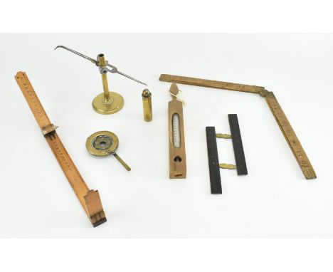 A group of 19th century measuring tools. The lot comprising a John Bednel&nbsp;wood shoe sizer, a Boxwood folding ruler, a ba