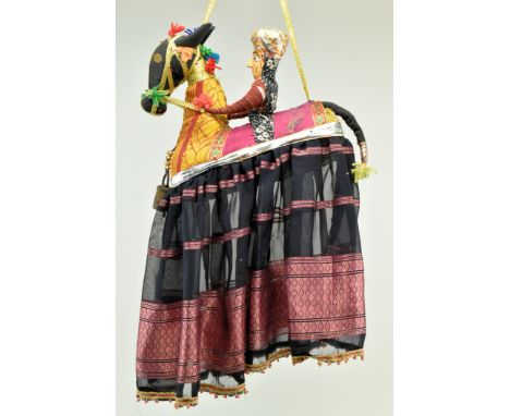 A vintage mid century Indian Kathputli hanging mobile cloth doll depicting a person riding a horse. The nursery mobile with g