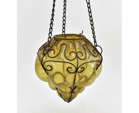 A vintage 20th century Mexican wrought iron and blown amber glass hanging light shade, in Venetian style. The rusted wrought 