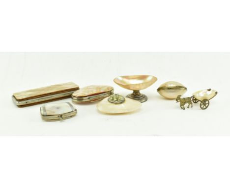 A collection of seven mostly early 20th century mother of pearl and metal trinkets and cases. The lot to include a small silv