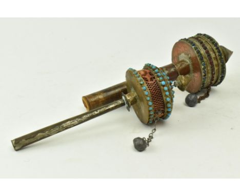 Two Tibetan Oriental late 19th century brass, copper &amp; wooden prayer wheels. The lot to include a wooden handle prayer wh