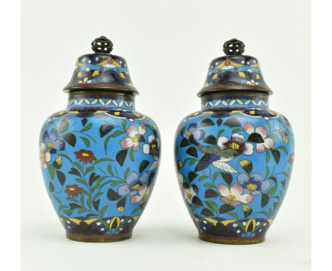 A pair of Japanese Meiji period cloisonne jars with cover.&nbsp; Each cloisonne jar decorated with cherry blossoms, butterfli