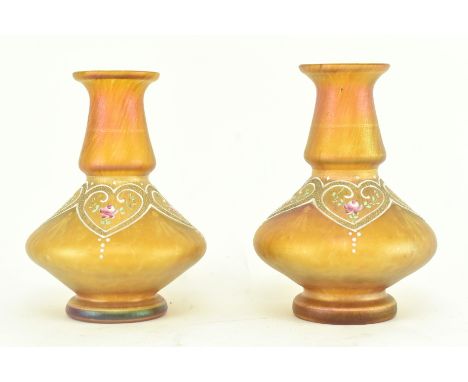 A pair of early 20th century Bohemian Art Nouveau lustre vases, likely by Loetz. Each vase with flared rim, low knopped neck 