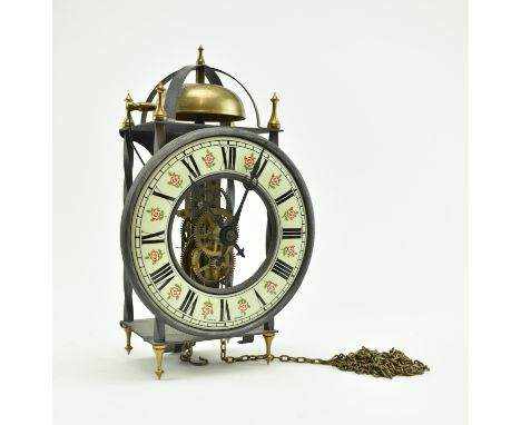 A mid-late 20th century German skeleton clock. The clock with Roman dial to enamel clockface, featuring rose pattern. Complet