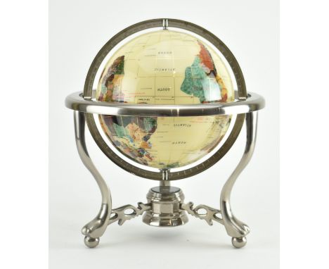 A vintage 20th century gemstone inlaid desktop globe. The globe of cream ground featuring precious stone inlaid countries. He