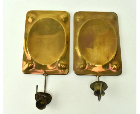 Two vintage mid century brass wall sconce candlestick holders. Each candlestick holder with a rectangular wall plate, one wit