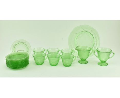 An early 20th century circa 1930s Depression era uranium pressed glass tea service, likely Hazel Atlas. Each piece with raise