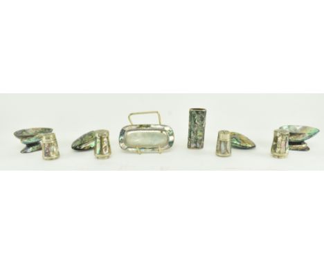 A collection of early - mid 20th century abalone and white metal trinkets and items. The lot to include three pepper shakers 