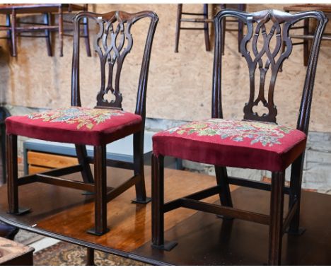 A pair of 19th century mahogany side chairs with floral tapestry seats 