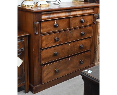 A Victorian mahogany chest with cavetto drawer over two short and three long graduating drawers with mother-of-pearl inlaid t