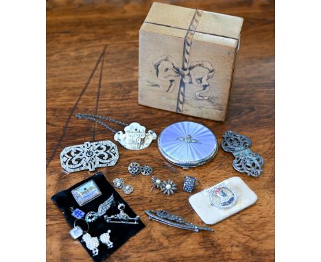 A silver and enamel powder compact set with RAF badge, Birmingham 1939, a Sterling RAF Air Gunner brooch set with marcasite a