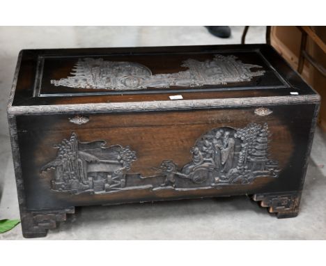 A Chinese carved hardwood and camphor lined trunk, 96 cm w x 48 cm d x 48 cm h