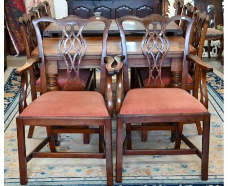 A set of eight Chippendale style mahogany dining chairs with terracotta fabric pad seats, two carvers and six standard (8)