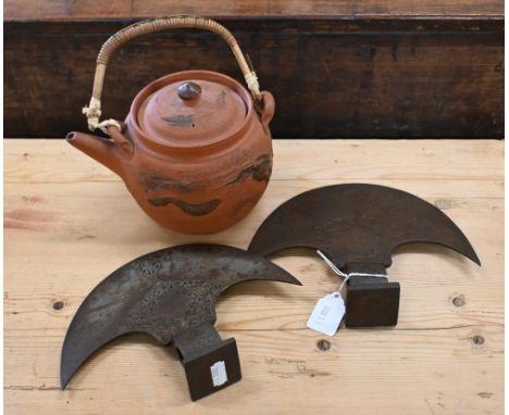 An Asian Yxing globular teapot impressed with dragons to/w a pair of Indian steel ceremonial axe-heads (3) 