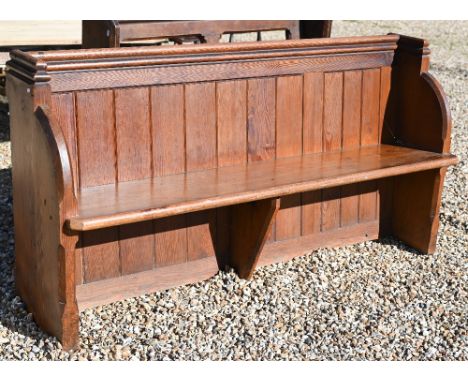 A stained pine church pew with panelled back, 168 cm w