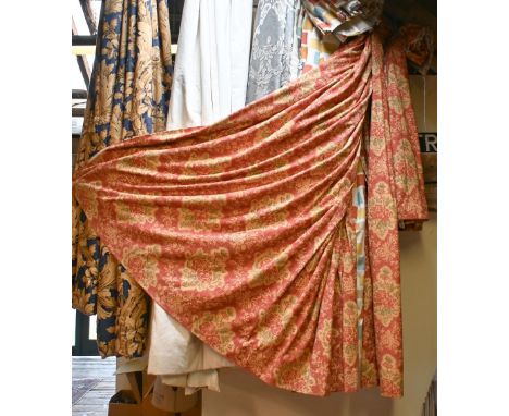 A pair of printed cotton curtains, 212 x 191 cm, terracotta ground with floral design, on view in café area