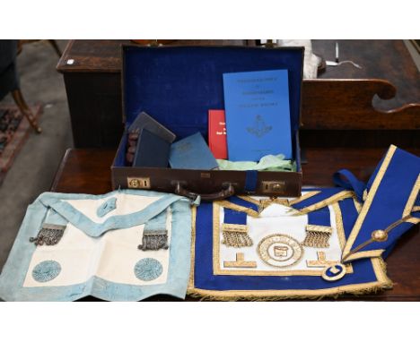 Two Masonic Aprons and sash with regalia, to/w various books etc in leather 'Pakawa' case