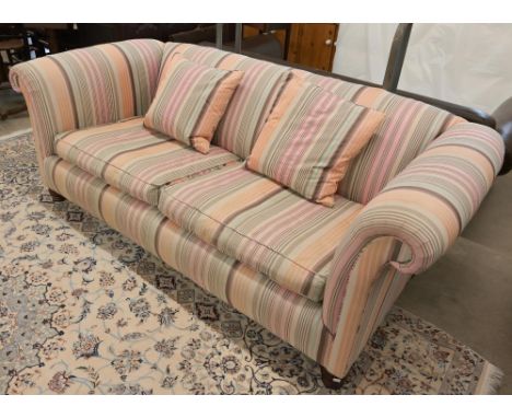 A scroll arm Chesterfield Derwent 'Keat' sofa with 'Kenzo' multi-coloured striped fabric upholstery, on low turned front legs