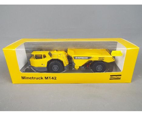 Atlas Copco - A boxed 1:50 diecast Atlas Copco MT42 Minetruck. The model in yellow appears to be in Mint condition and is pre