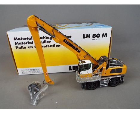 NZG - A boxed diecast 1:50 scale NZG #810 Liebherr LH80M Litronic Excavator. The model in yellow and white appears to be in M