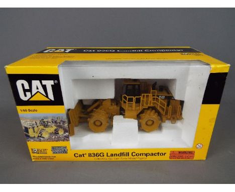 Norscot - A boxed 1:50 scale diecast Norscot #55074 Caterpillar 836G Landfill Compactor. The model appears to be in Mint cond