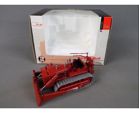 Spec Cast - A boxed 1:50 scale diecast Spec Cast International Harvester TD 24 Diesel Crawler with Hydraulic Blade. The model