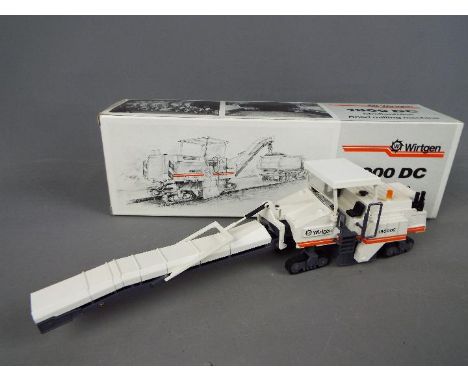 NZG - A boxed diecast 1:50 scale NZG #379 Wirtgen 1900 DC Road Milling Machine. The model in white, black and orange appears 