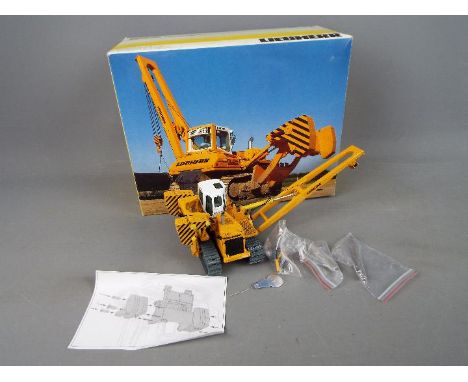 NZG - A boxed diecast 1:50 scale NZG #799 Liebherr RL 64 Litronic Pipelayer. The model in yellow and white appears to be in M