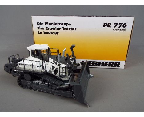 WSI - A boxed 1:50 scale WSI 04-1162 Liebherr PR776 Litronic Crawler Tractor. The model in grey and white appears to be in Mi