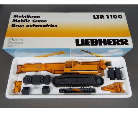 Conrad - A boxed diecast 1:50 scale Conrad 2738 Liebherr LTR 1100 Mobile Crane. The model in yellow appears to be in Mint con