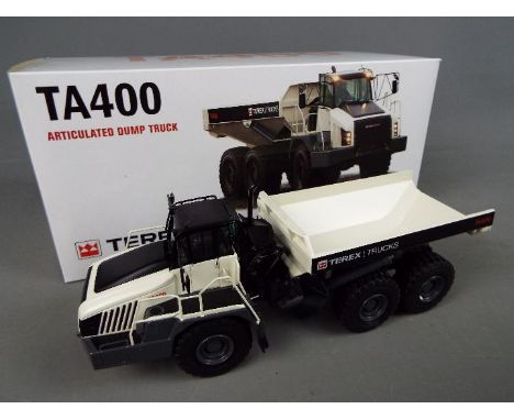 NZG - A boxed diecast 1:50 scale NZG #973  Terex TA400 Articulated Dump Truck. The model in white and black appears to be in 