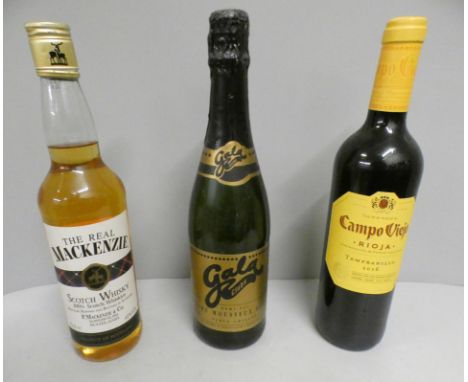 A bottle of The Real Mackenzie scotch whisky, Camoviejo Rioja and Gala Clubs demi-sec sparking wine 