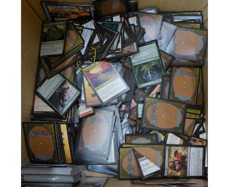 A box of Magic The Gathering gaming/playing cards 